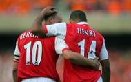 Thierry Henry (R) of Arsenal celebrates scoring against Ajax with teammate Dennis Bergkamp during a pre season "Dennis Bergkamp" testimonial match at Emirates stadium in north London, 22 July 2006. The match played in honour of Arsenal's Dutch player Dennis Bergkamp who has served the club for 11 years and will retire after the game is the first match played at the club's new stadium. AFP PHOTO / ODD ANDERSEN  (Photo credit should read ODD ANDERSEN/AFP/Getty Images)